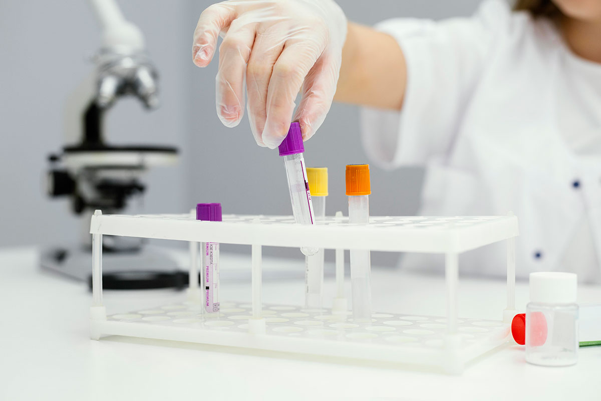 girl-scientist-with-test-tubes-lab-coat